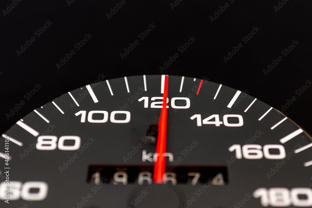 Car speedometer with the needle pointing a high speed at blackground, Speedometer with a red arrow indicating speeding, conceptual image for excessive speeding or careless driving concept.Close-up. Car speedometer with the needle pointing a high speed at blackground, Speedometer with a red arrow indicating speeding, conceptual image for excessive speeding or careless driving concept.Close-up.
