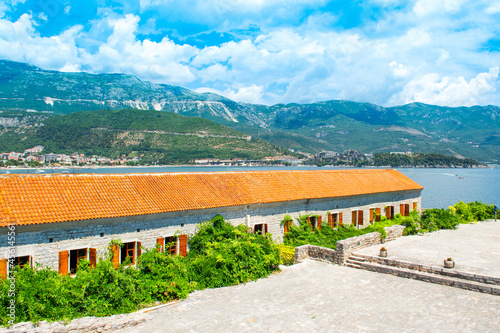 Beautiful summer landscape of the Budva waterfront and library - view from Citadel, Montenegro photo