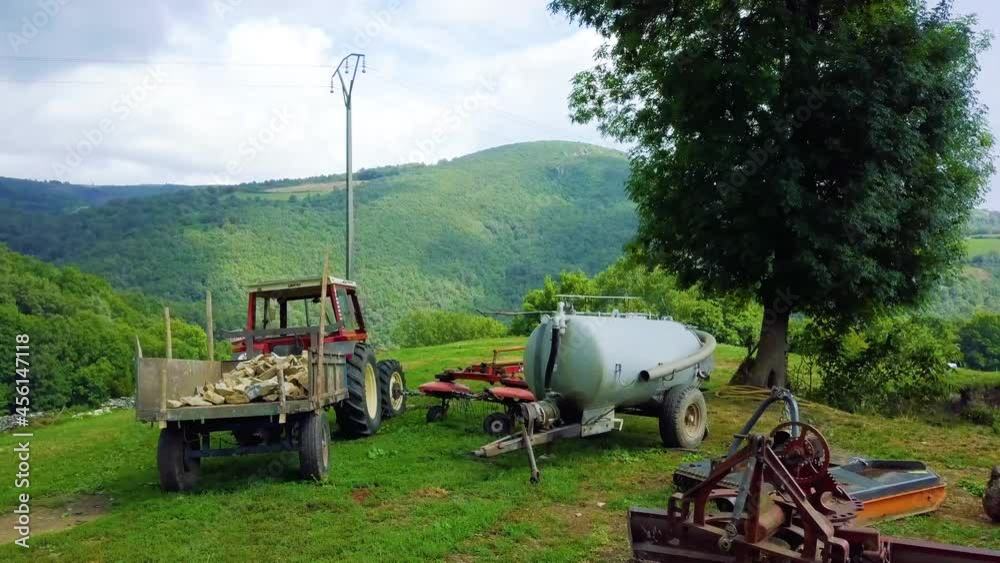 tractor, tanker and farm machinery in a beautiful mountain valley
tractor, tanker and farm machinery in a beautiful mountain valley