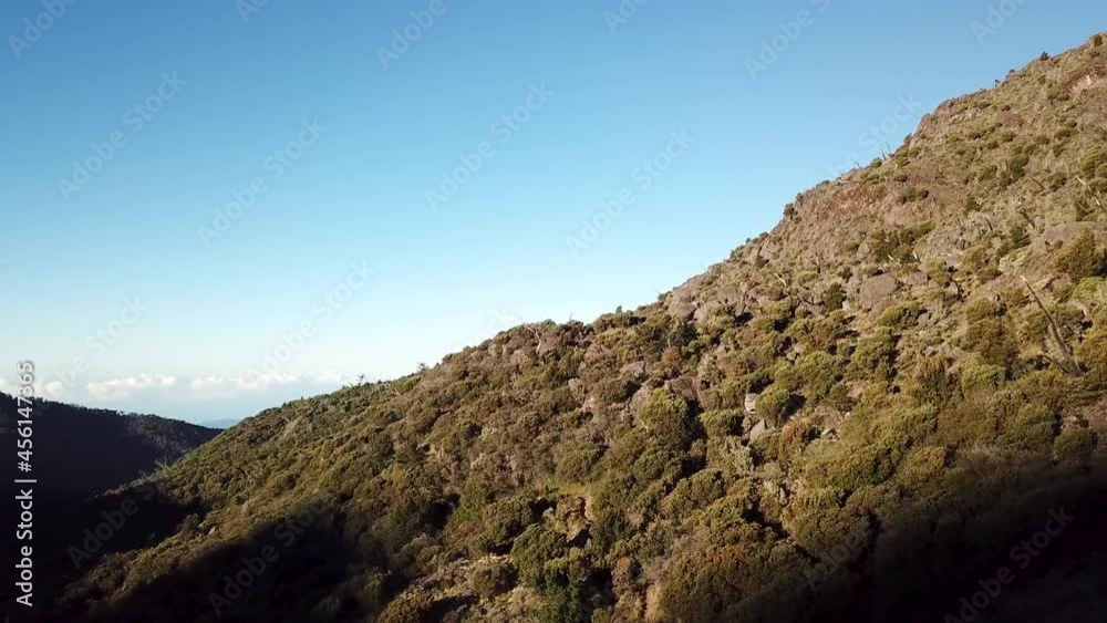 Drone flying forward towards mountain side blue sky on evening sunset Cerro Chirripo in Costa Rica, Central America Drone flying forward towards mountain side blue sky on evening sunset Cerro Chirripo in Costa Rica, Central America