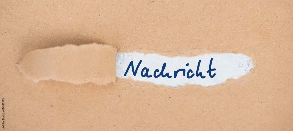 The german word message is stand on an old textured paper The german word message is stand on an old textured paper