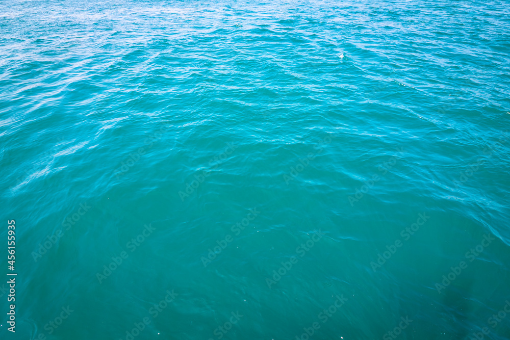 Turquoise wavy sea background. Sea texture.