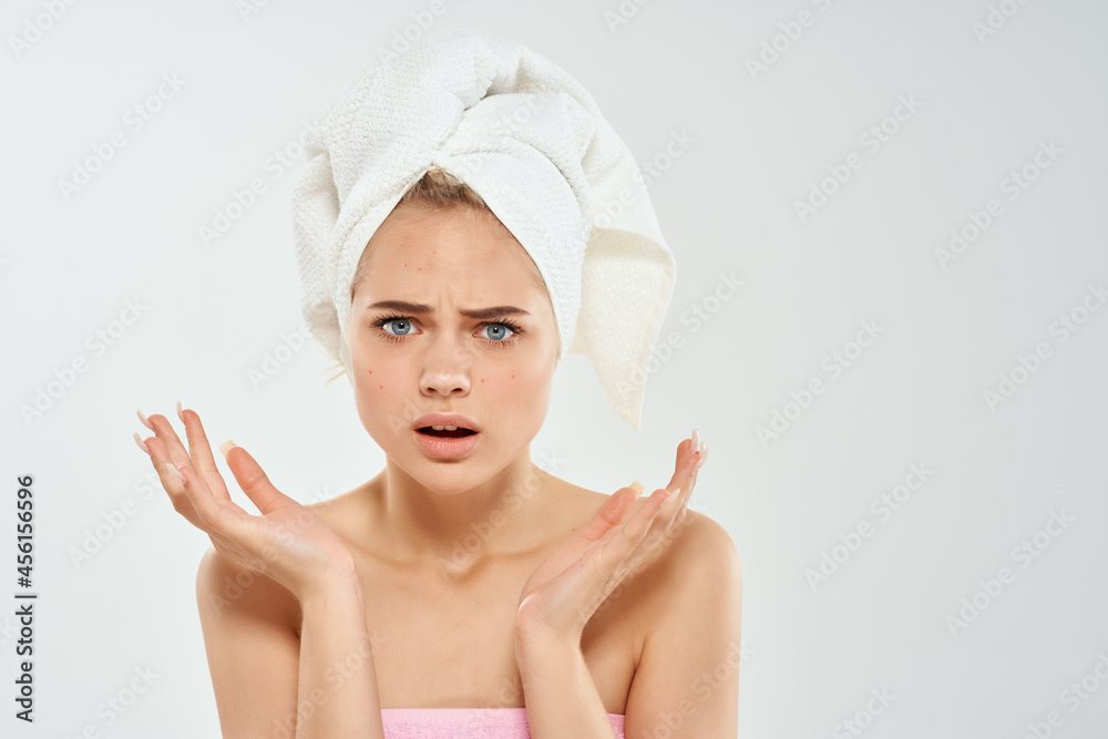 woman with towel on head dermatology skin care close-up woman with towel on head dermatology skin care close-up