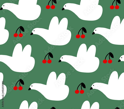 White birds with cherry berries on green background seamless pattern.