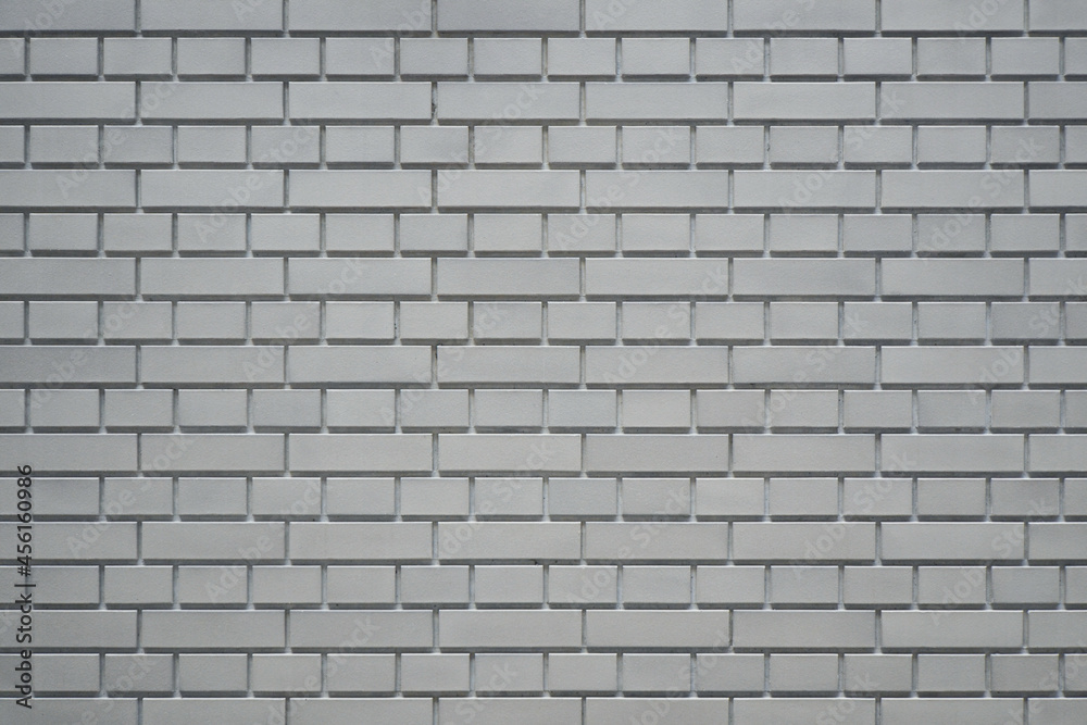 Luxury gray brick wall texture background. Close up of stylish brick wall.
