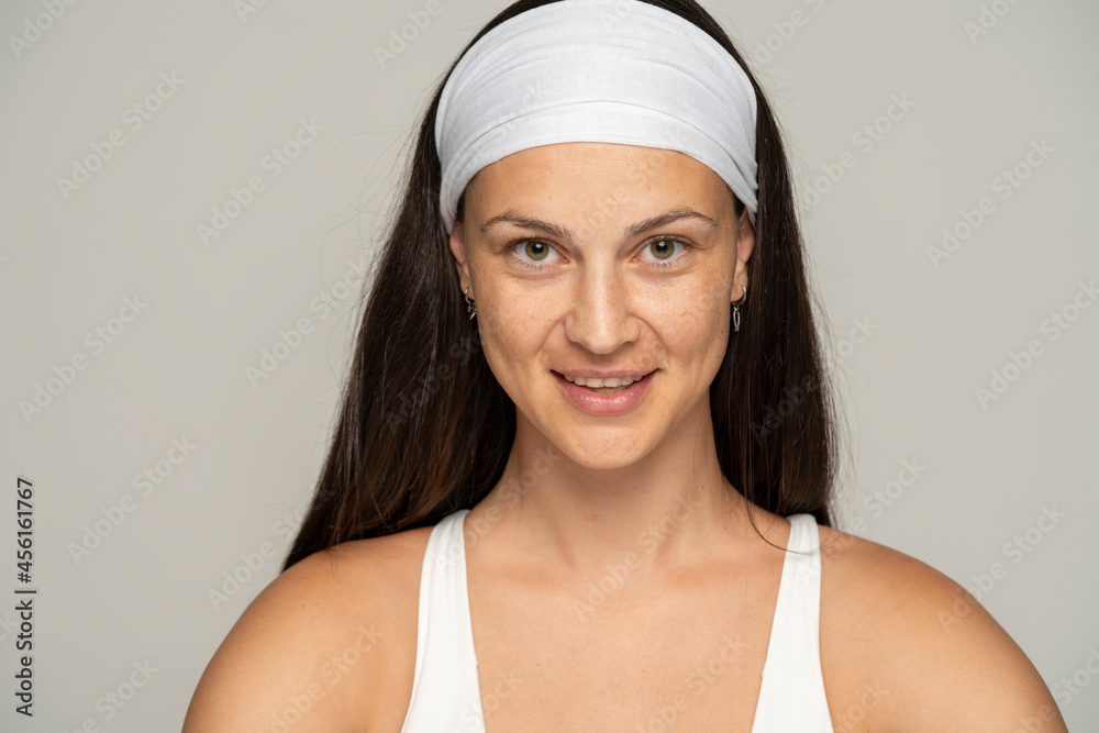 Portrait of a young happy woman without makeup and headband Portrait of a young happy woman without makeup and headband