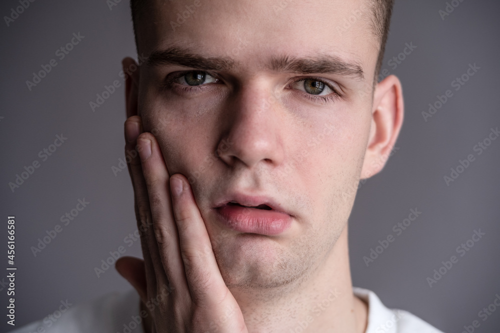 Sad Young Guy Teen Holding A Face. toothache