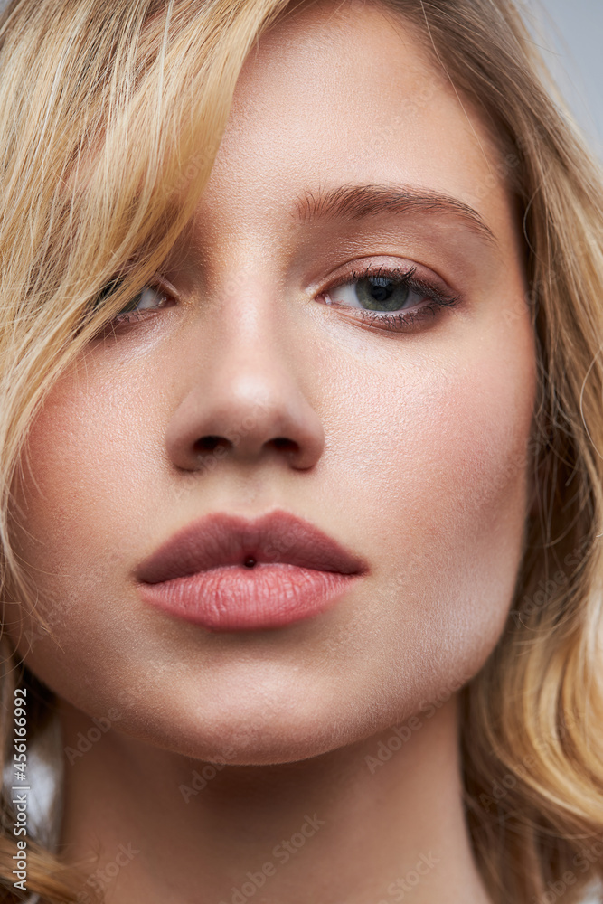 Pretty lady with clear skin posing with no makeup.