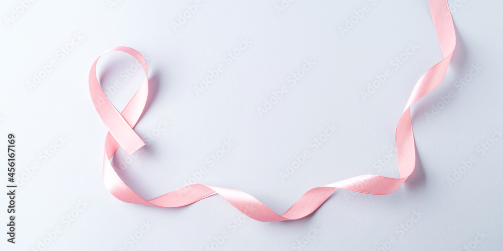 Breast cancer awareness pink ribbon symbol on gray background Breast cancer awareness pink ribbon symbol on gray background