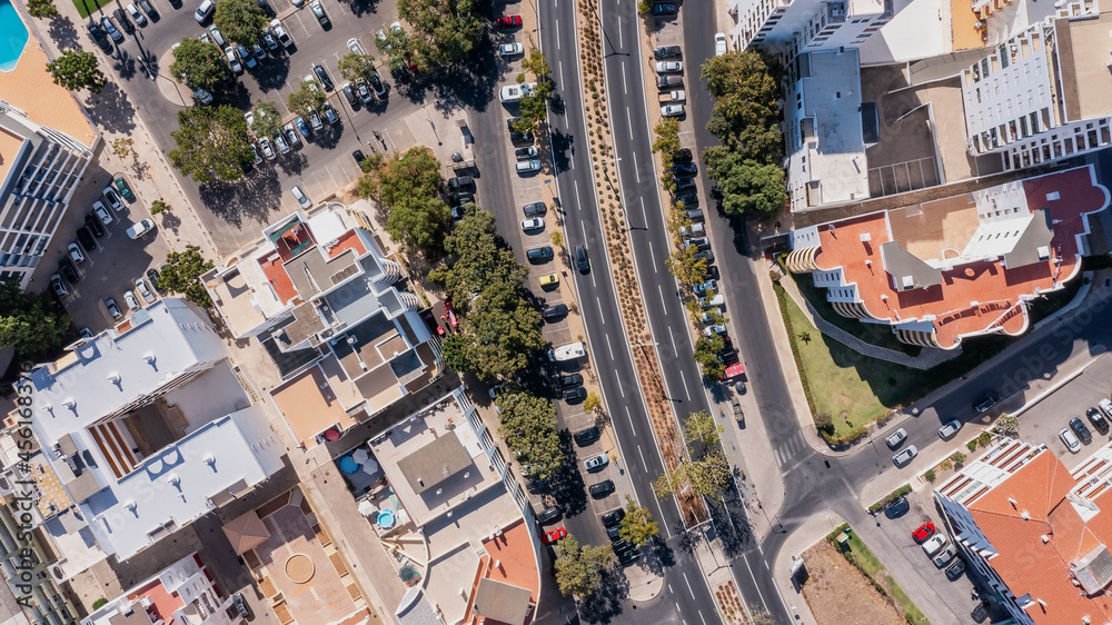 © Sergo - Aerial cityscape of houses and streets of Portugal cities. View from above., top view. Quarteira. © Sergo - Aerial cityscape of houses and streets of Portugal cities. View from above., top view. Quarteira.