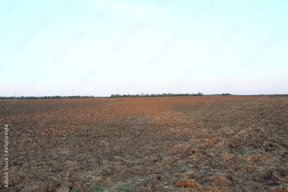Plowed agricultural field at the evening Plowed agricultural field at the evening