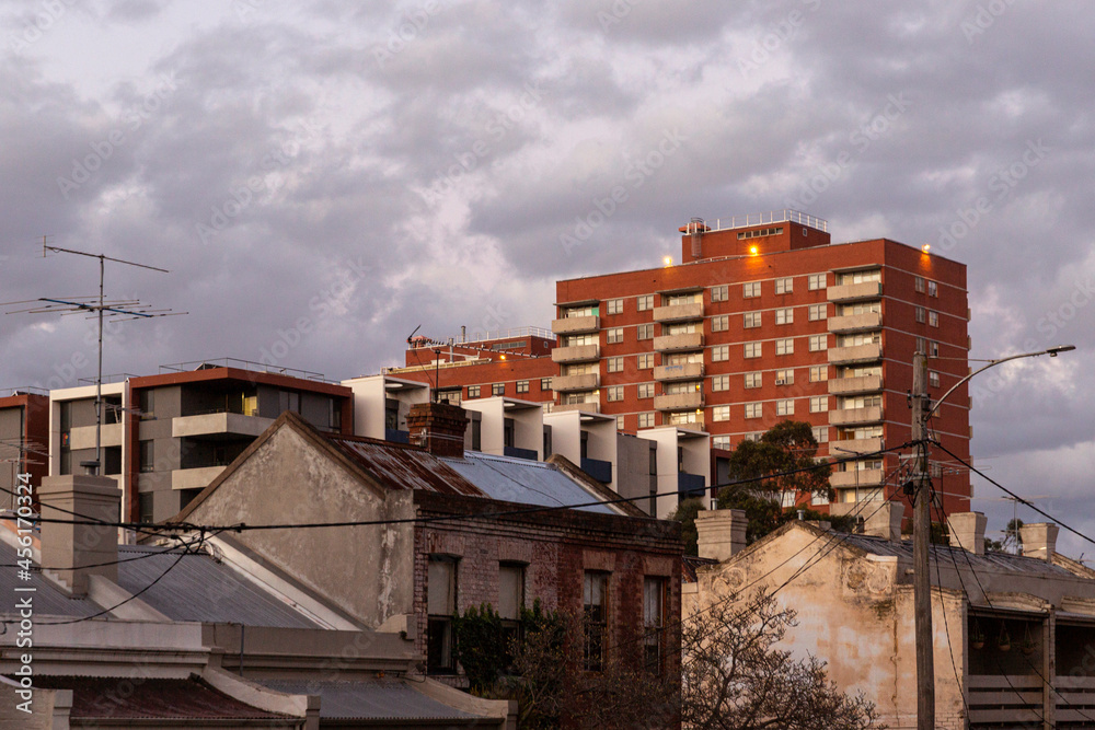 Old houses near modern apartment building. Old houses near modern apartment building.