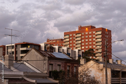 Old houses near modern apartment building.
