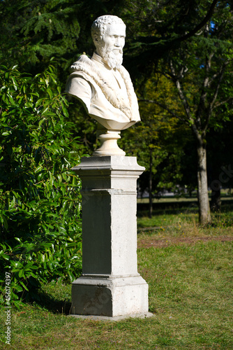 Bust of Italian artist Michelangelo at Ariana Park Geneva on a sunny summer morning. Photo taken August 28th, 2021, Geneva, Switzerland.