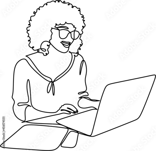 one line drawing of a woman sitting with laptop computer. Young female in glasses using laptop, communicates on internet with customer in home, reusable coffee tea mug 