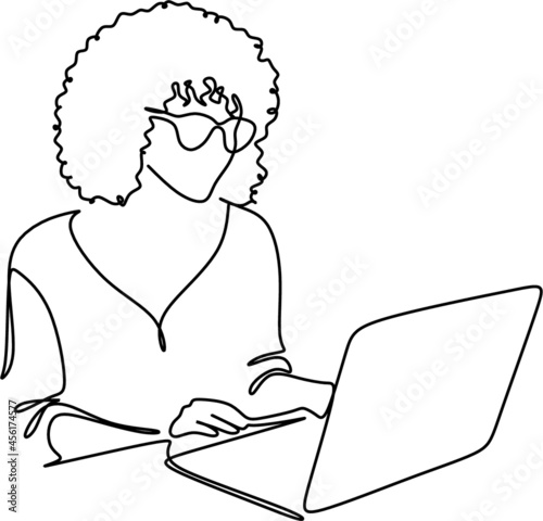 one line drawing of a woman sitting with laptop computer. Young female in glasses using laptop, communicates on internet with customer in home, reusable coffee tea mug 