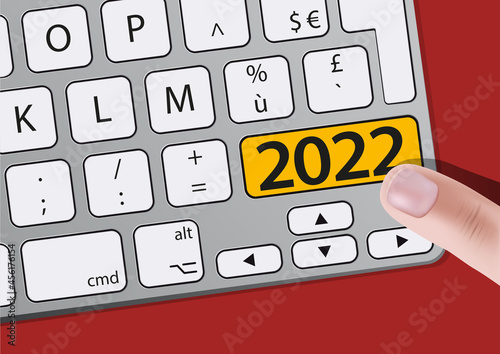 Un doigt appuie sur une touche d’un clavier d’ordinateur sur laquelle est écrit l’année 2022, pour présenter les objectifs d’une entreprise.