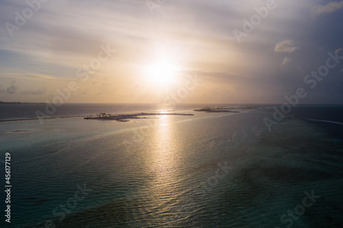 Fantastic Maldivian uninhabited islands on the sunrise. July 2021, aerial drone picture. photo