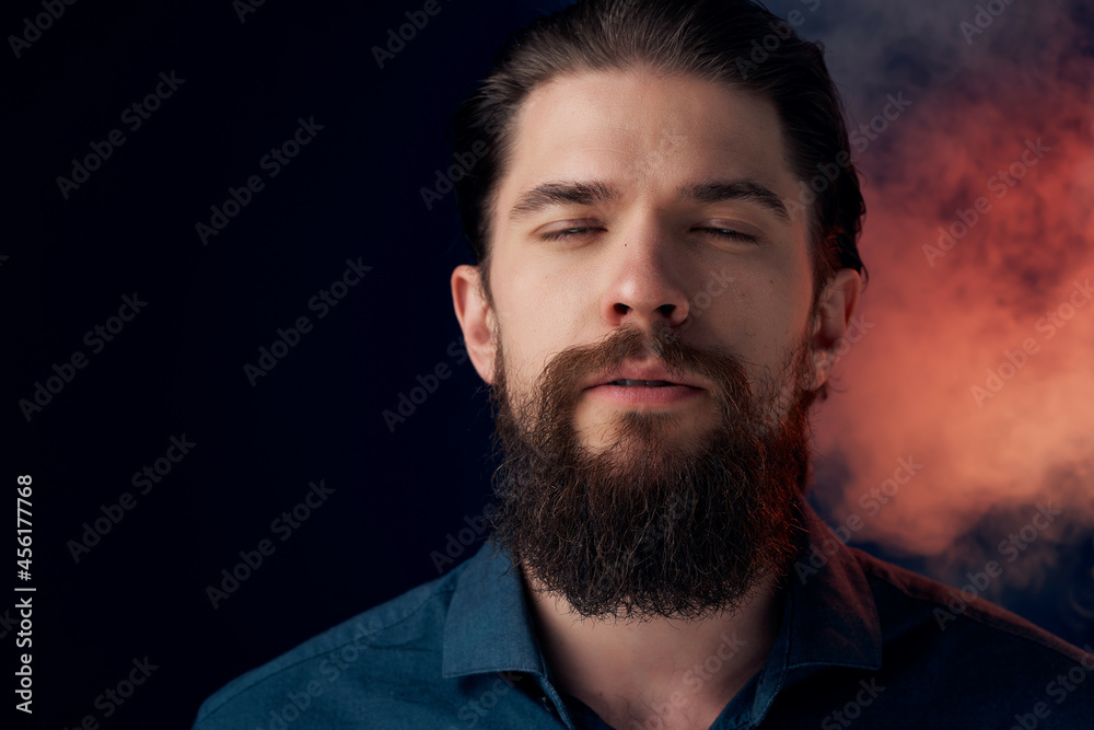 bearded man in a black shirt smoke clouds dark background bearded man in a black shirt smoke clouds dark background