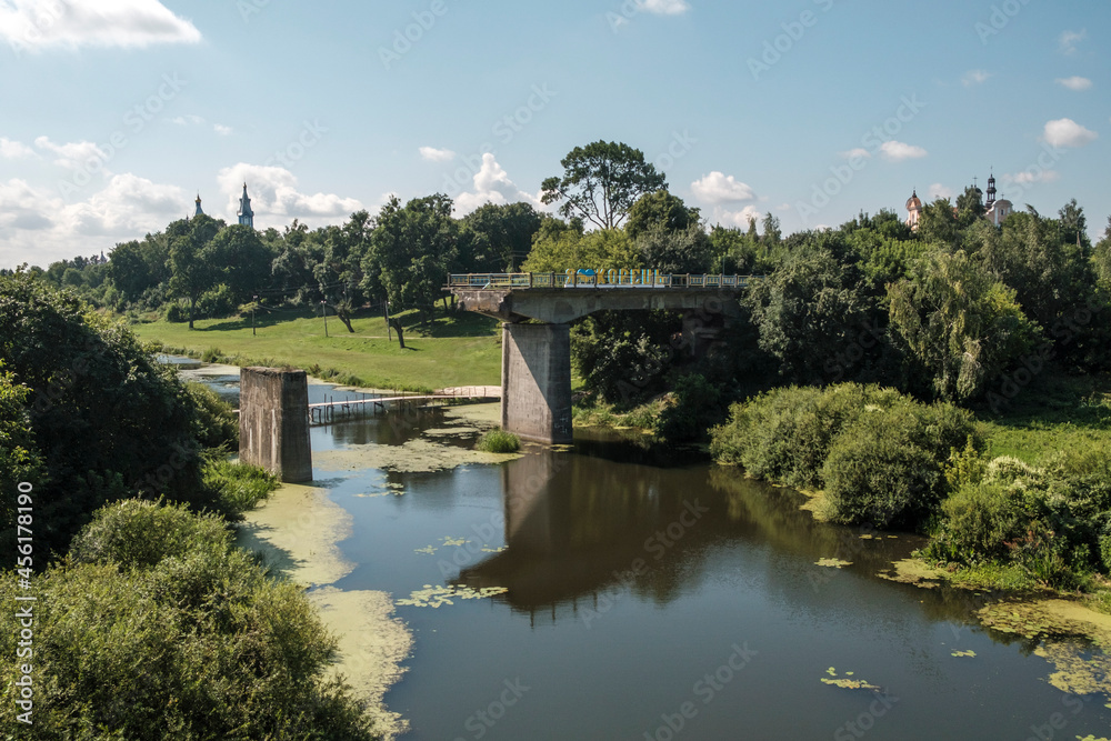 View of the river Korchyk and the unfinished bridge with the inscription I love Korets on. Korets, Rivne region, Ukraine