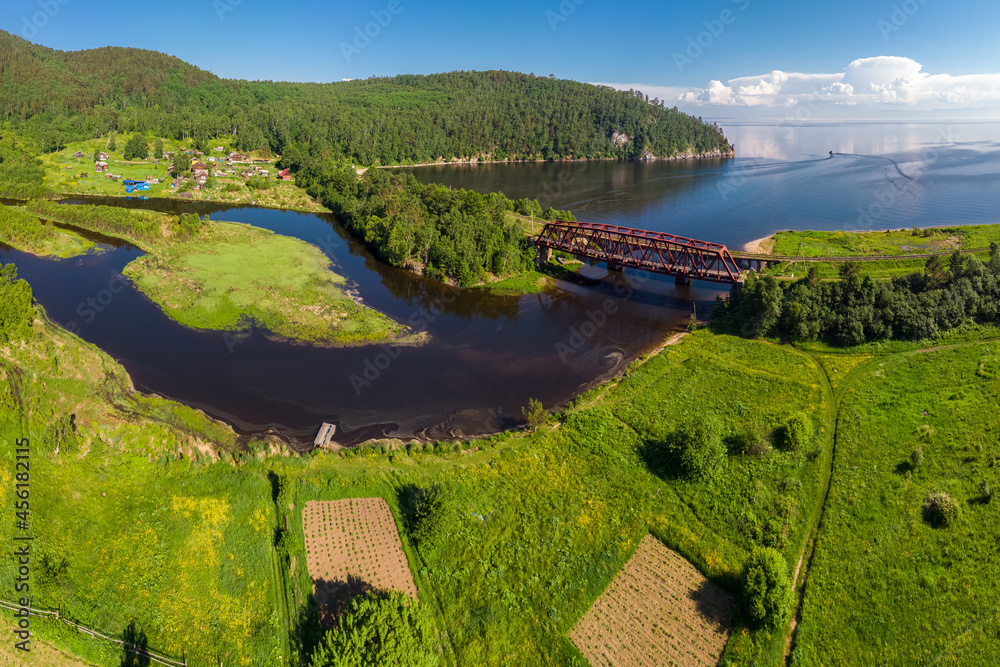 Fototapeta premium Aerial view of the bridge over the Polovinnaya River on the Circum-Baikal Railway