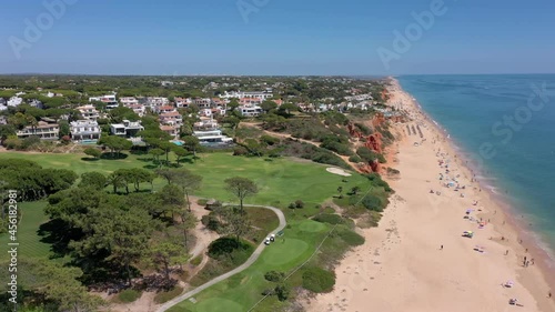 Aerial video shooting of a tourist village on the Atlantic Ocean, with golf courses, Vale de Lobo. Portugal Algarve.
