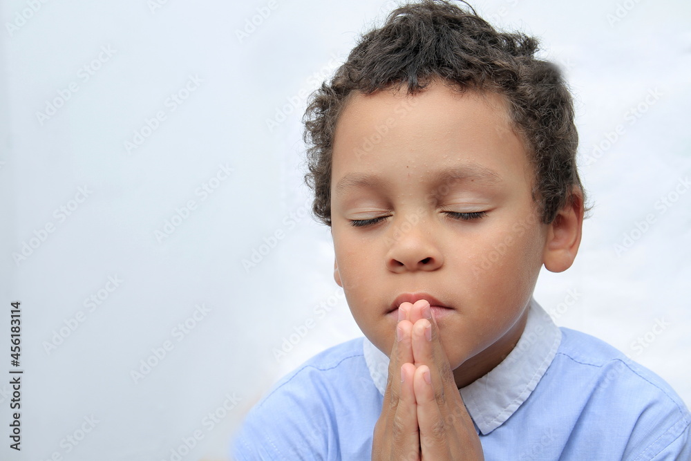 little boy praying to God with hands together stock photo little boy praying to God with hands together stock photo
