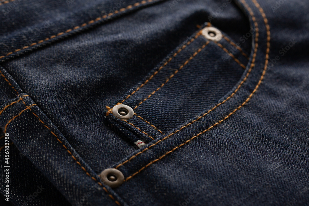 Textile of classic blue jeans with pocket close up. Textile of classic blue jeans with pocket close up.