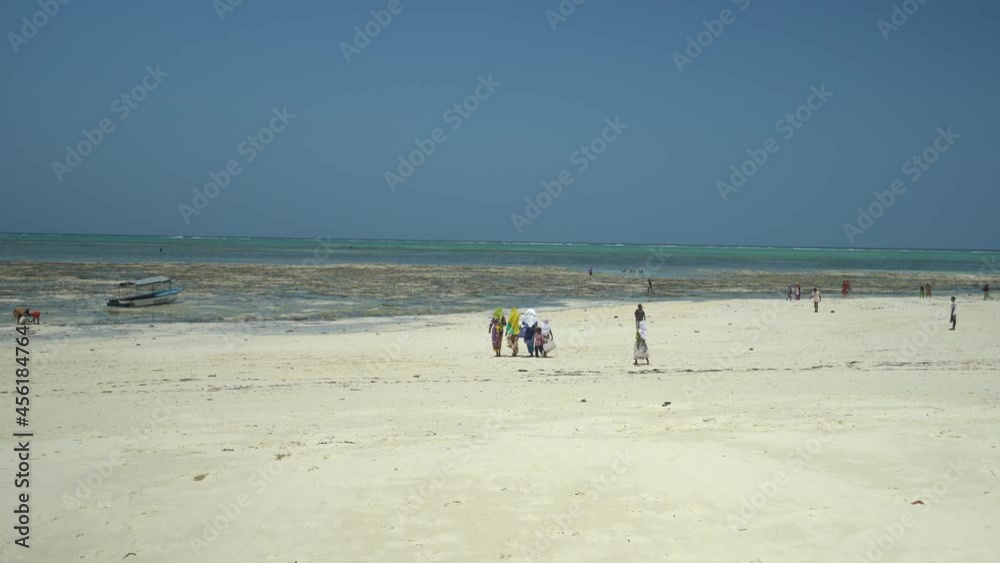 Paje beach, east cost Zanzibar,Local people on the beach. Paje beach, east cost Zanzibar,Local people on the beach.