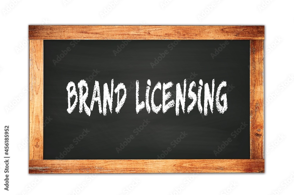 BRAND LICENSING text written on wooden frame school blackboard. BRAND LICENSING text written on wooden frame school blackboard.