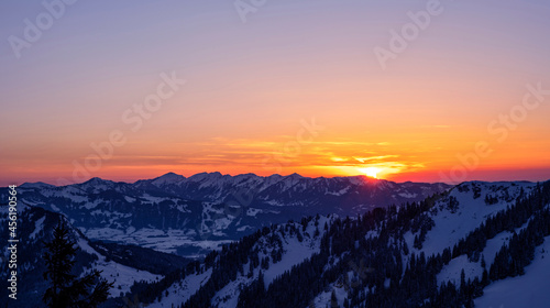 Colorful sunset over snowy mountains in winter. Allgau Alps, Bavaria, Germany