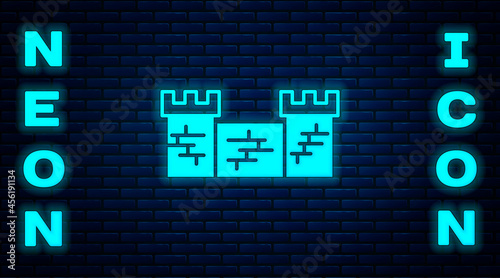 Glowing neon Great wall of China icon isolated on brick wall background. Vector