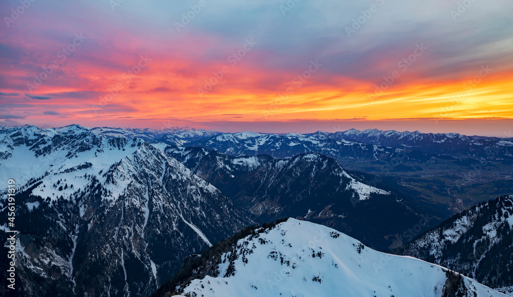 Colorful sunset over snow-covered mountains. Allgau Alps, Bavaria, Germany