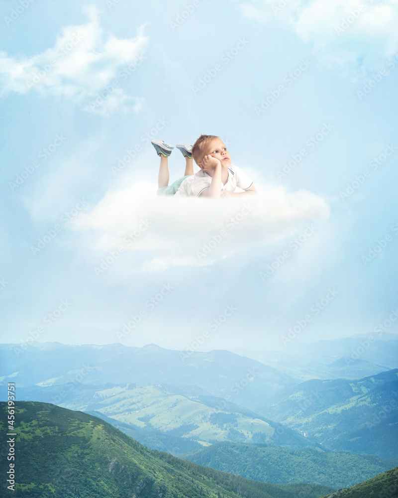 Art collage with little cute boy lying on white cloud and flying above land, mountains, nature landscape. Concept of childhood, happiness, dreams Art collage with little cute boy lying on white cloud and flying above land, mountains, nature landscape. Concept of childhood, happiness, dreams