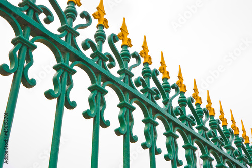 Old wrought iron grating yellow and green color photo