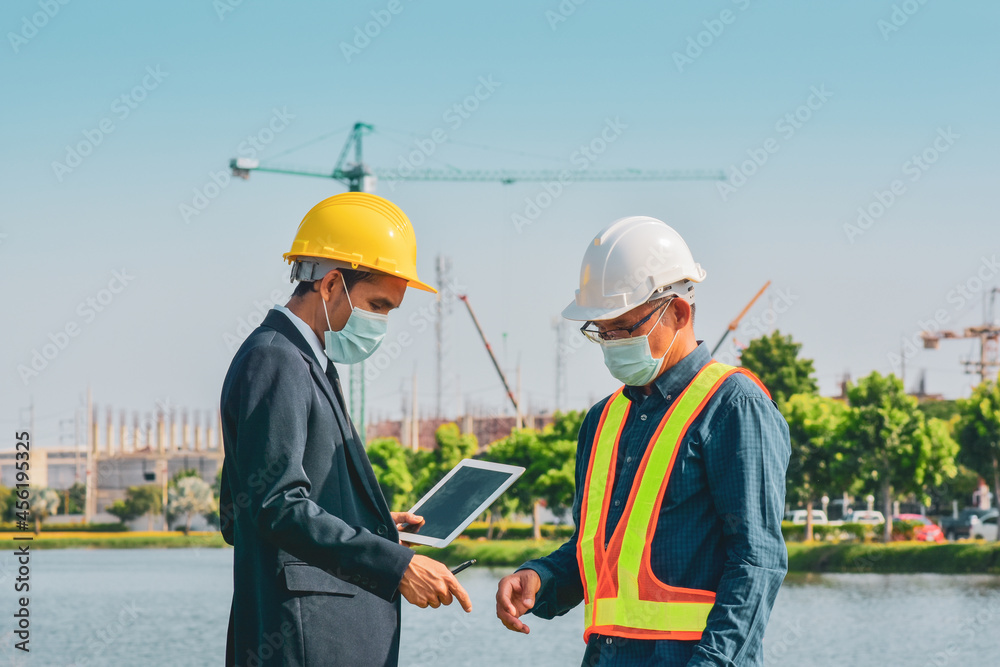 Manager work with Engineer construction tablet technology Manager work with Engineer construction tablet technology