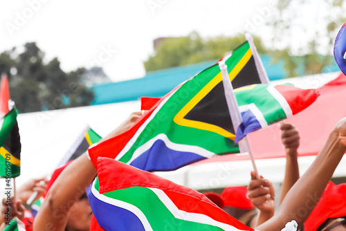 Canvastavla Closeup of the people holding the flags of South Africa.