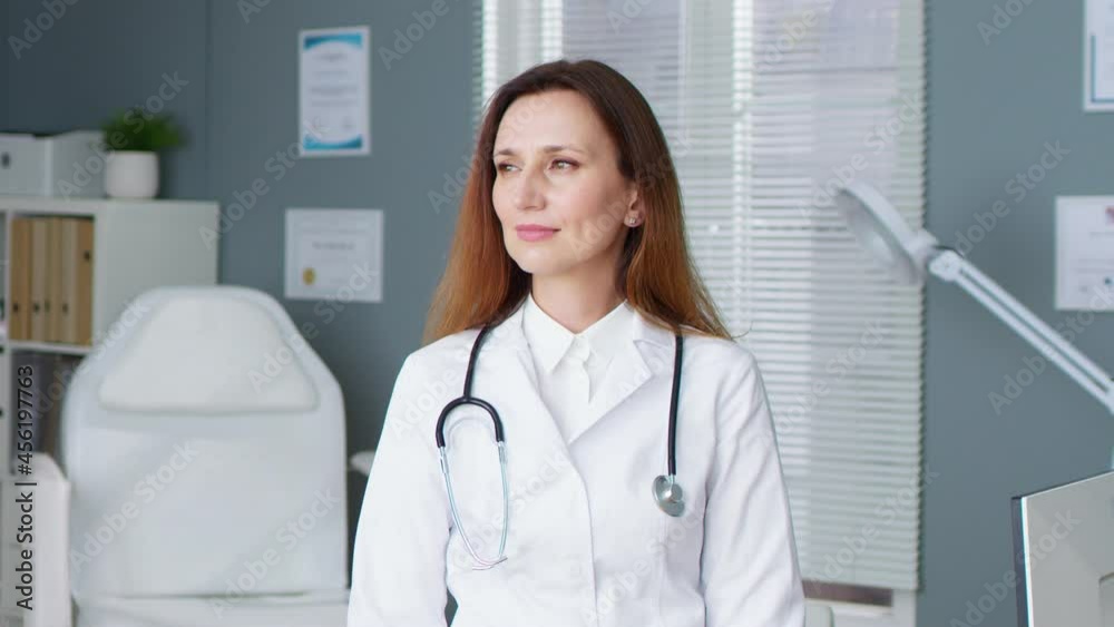 Close up portrait of beautiful caucasian woman medical worker standing in hospital, looking at camera with happy face. Young female physician at work in clinic. Healthcare professional concept Close up portrait of beautiful caucasian woman medical worker standing in hospital, looking at camera with happy face. Young female physician at work in clinic. Healthcare professional concept
