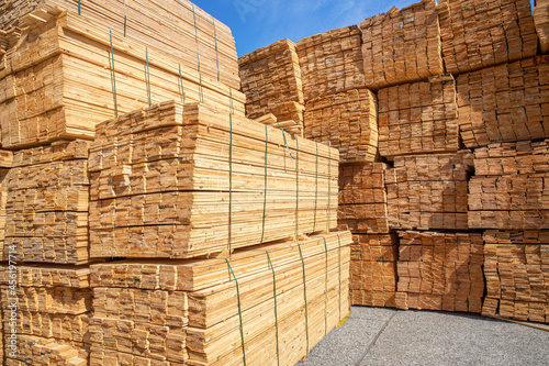 Wooden boards, lumber, industrial wood, timber. Pine wood timber stacked at the port site 