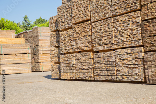 Wooden boards, lumber, industrial wood, timber. Pine wood timber, Scrap timber stacked at the port site 