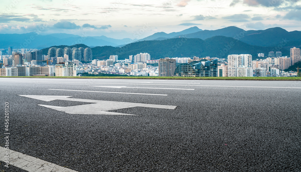 Road and city buildings background Road and city buildings background