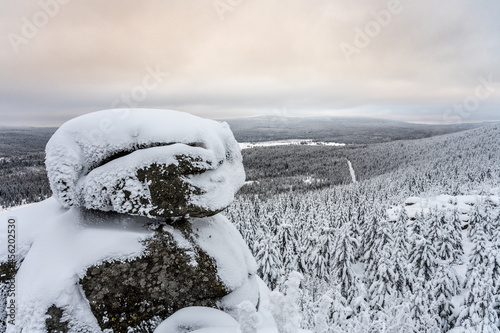 Wintertime forest landscape around Poacher Rocks, Czech: Pytlacke kameny, in Jizera Mountains, Czech Republic photo