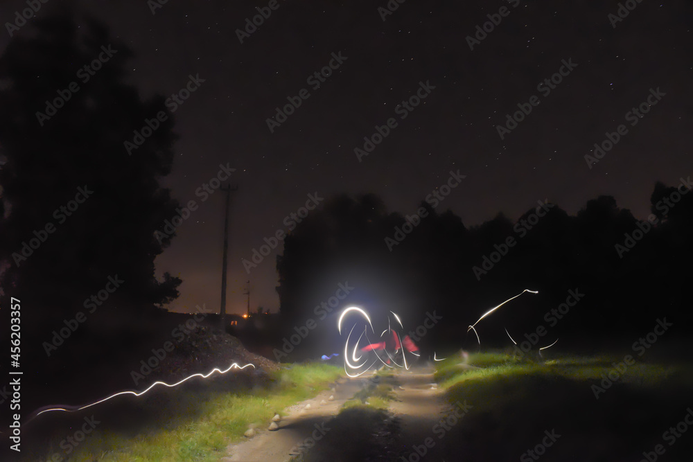 Luminous abstract image, painting with light on a warm spring night