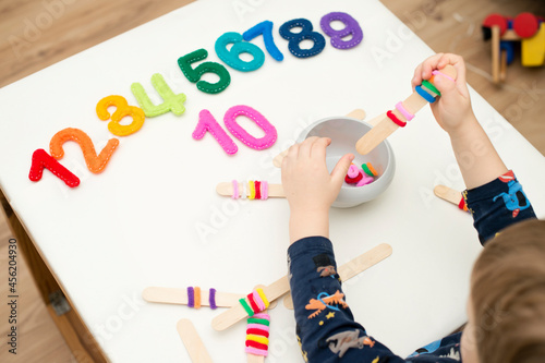 Logic and counting game for early education. Stuffed felt numbers and Popsicle Sticks with hair tie gum on it. Each popsicle have dedicated number of ring.