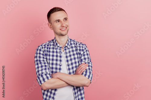 Wallpaper Mural Portrait of attractive young man crossed hands dream look empty space confident isolated on pink color background Torontodigital.ca