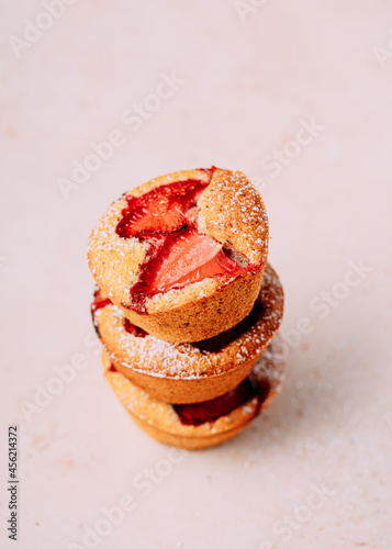 homemade strawberry muffins, little cakes, strawberry and pistachio friands photo