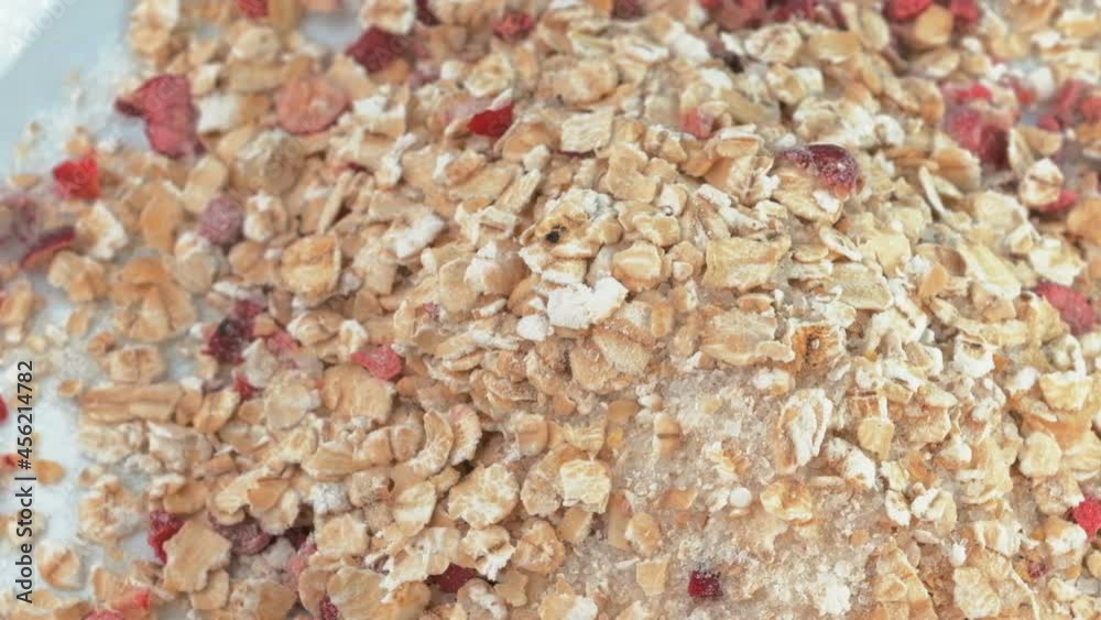 Oatmeal with dried cranberries in cream five times slow motion video close-up Oatmeal with dried cranberries in cream five times slow motion video close-up