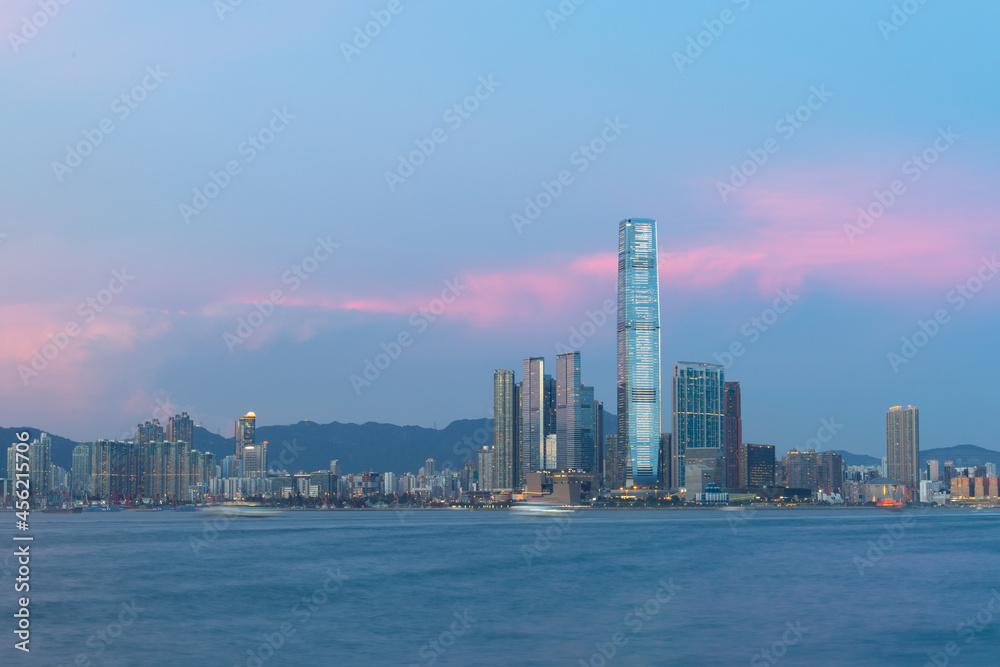 sunset view of cityscape of buildings along Victoria Harbour, tsim sha tsui, Kowloon and New territories, Hong Kong