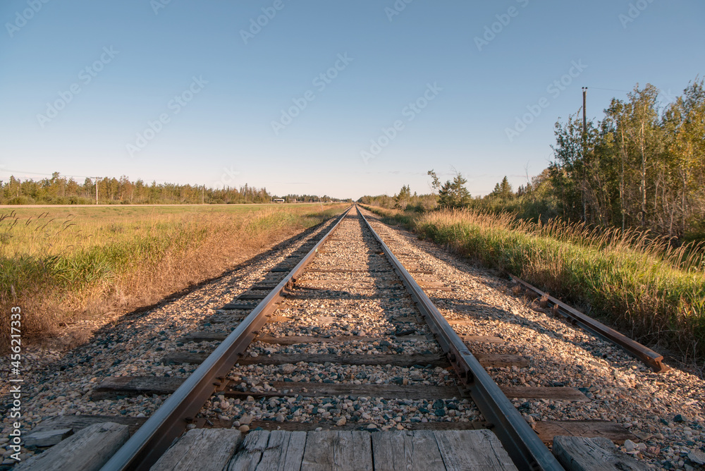 Railroad tracks in rural Saskatchewan on the prairies of Canada.