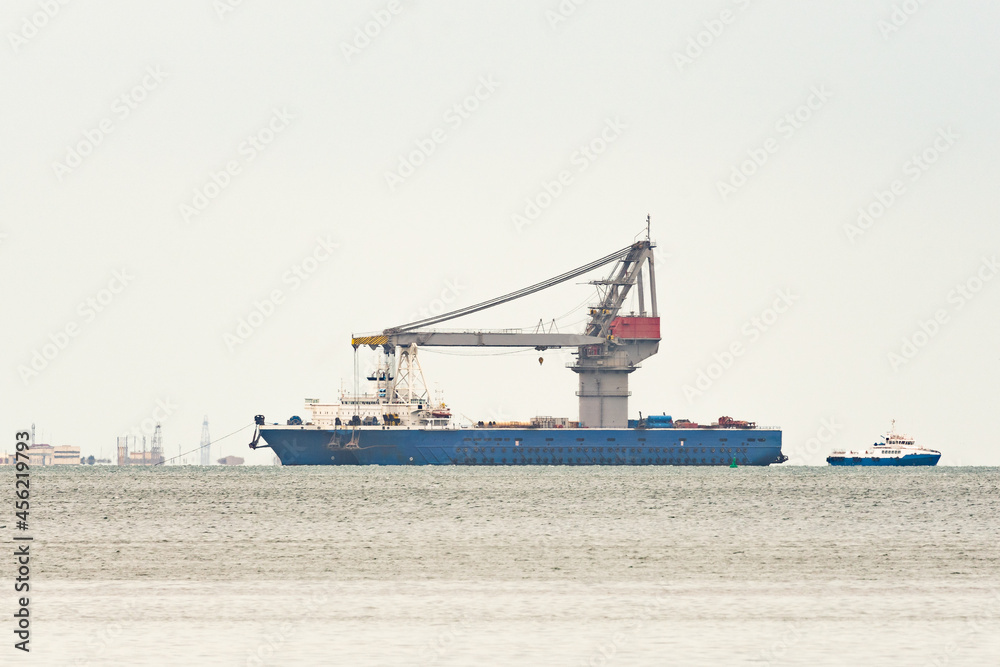 Ship crane loader at sea